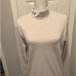 Womens Size M Under Amour’s long sleeve top in a very light white gray.